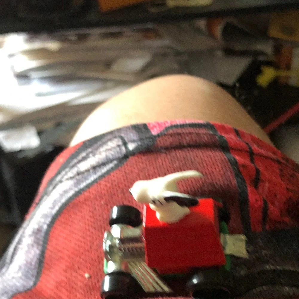 Red Toy Car with White Bull Figure